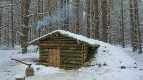 Building a small house in the winter woods, Shelter from fallen trees, Log Cabin